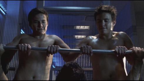 "Help!  I'm being held down by two identical guys who are way more cut than me!"